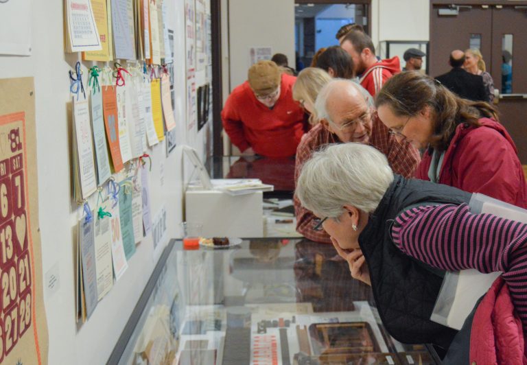 David Peat explains his work to a member of the community.