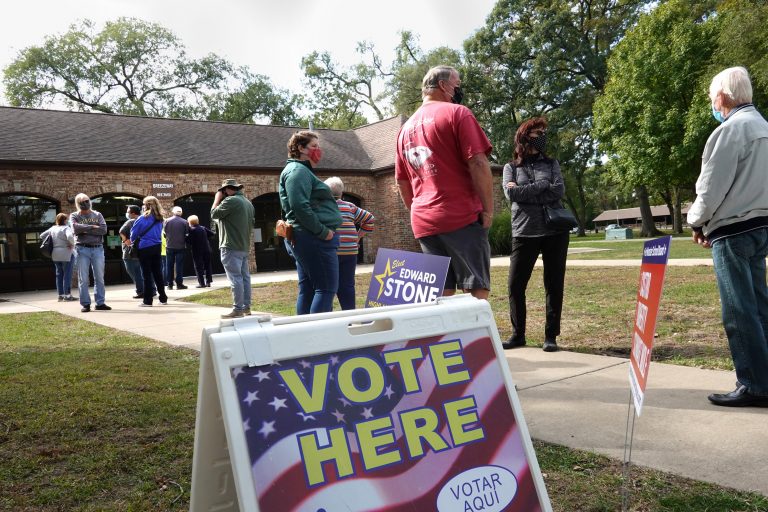 Residents wait in line to vote at the Wicker Park Social Center on October 06, 2020 in Highland, Indiana