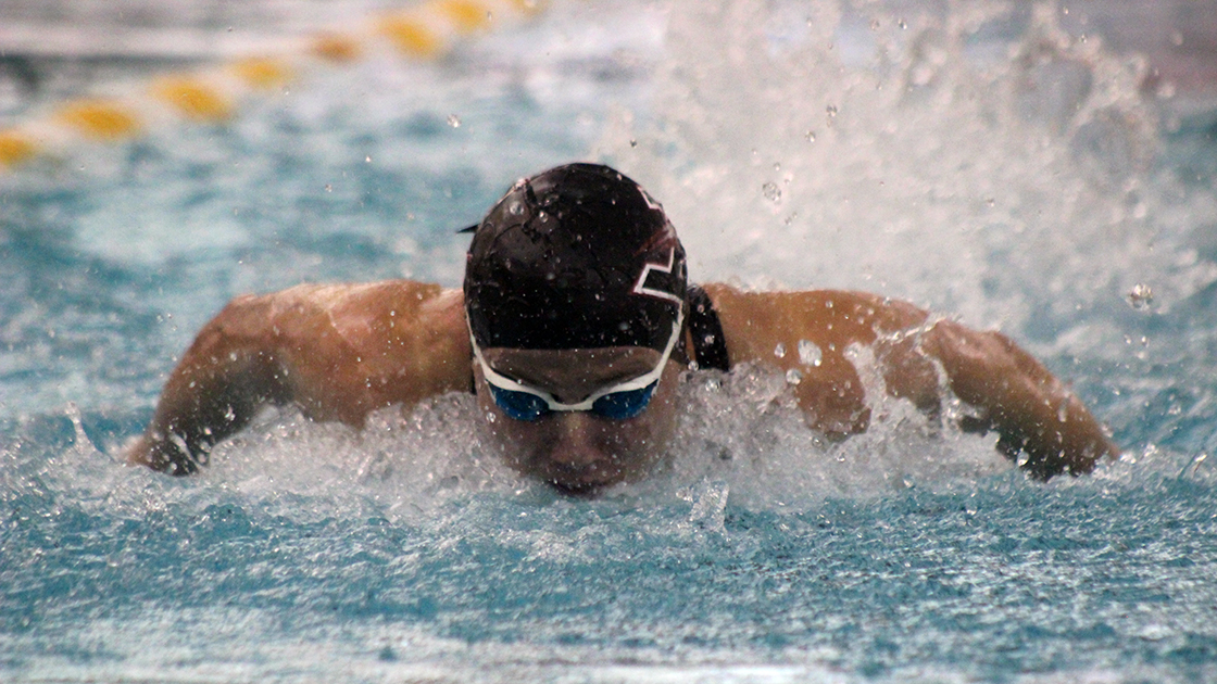 Junior swimmer Johanna Buys performs the butterfly stroke during the UIndy Intersquad meet on Oct. 17. In the meet, the Hounds were divided into Crimson and Grey, with Crimson winning the meet with a score of 692-664. Buys won the 100 free in 53.26 seconds