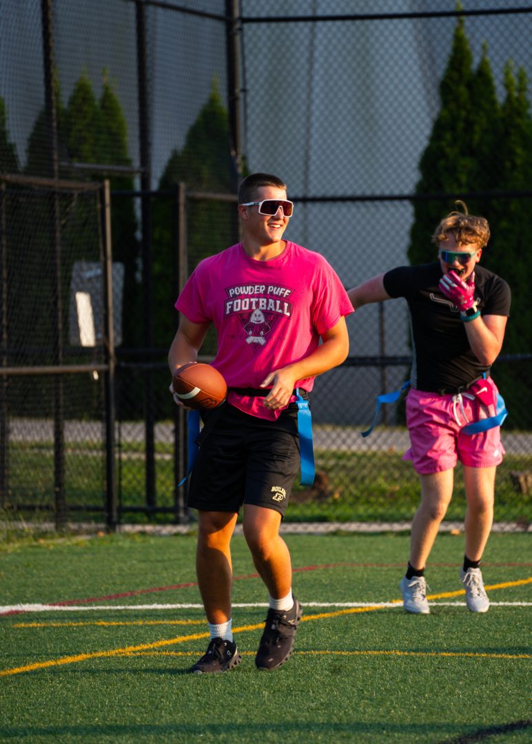 Two men practicing flag football