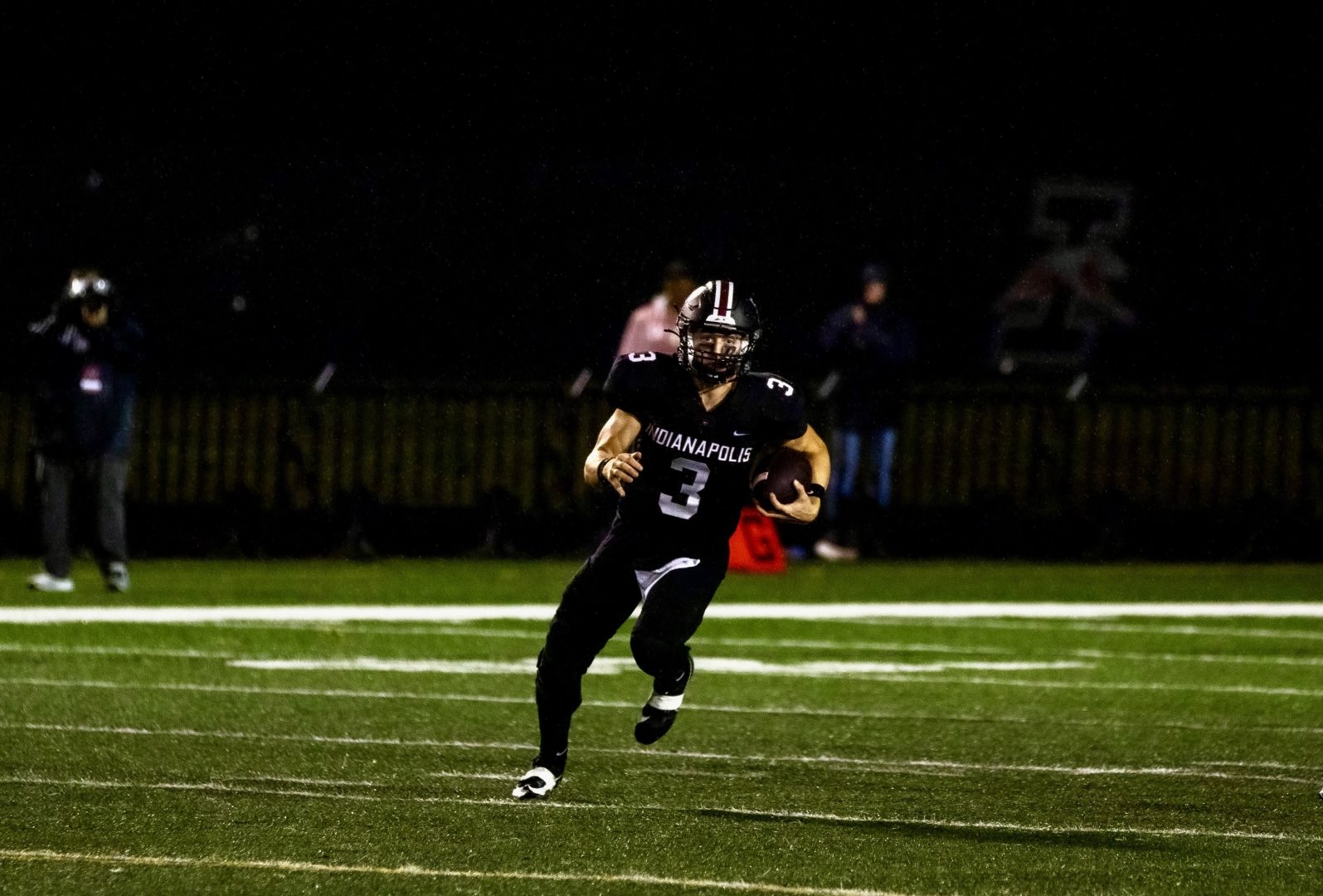 Junior quarterback Gavin Sukup playing football