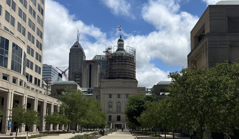 Indiana Statehouse with construction on the dome during a sunny day