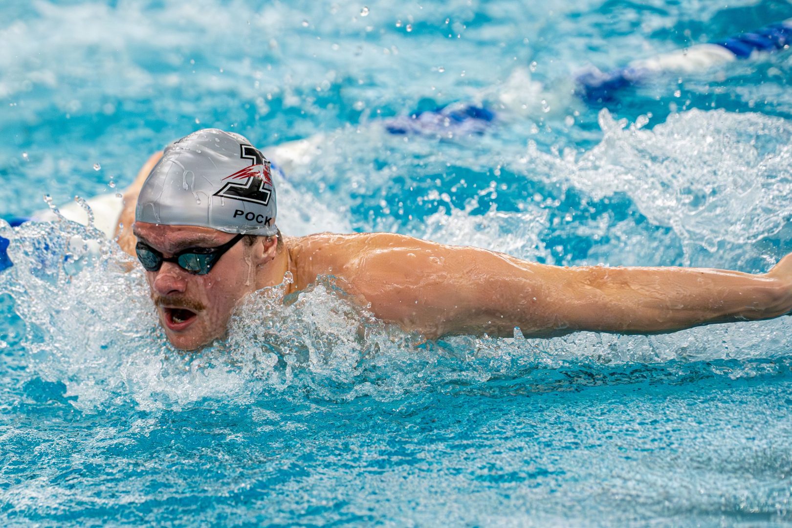 UIndy swimmer Jeremias Pock glides through the water for UIndy swim & dive