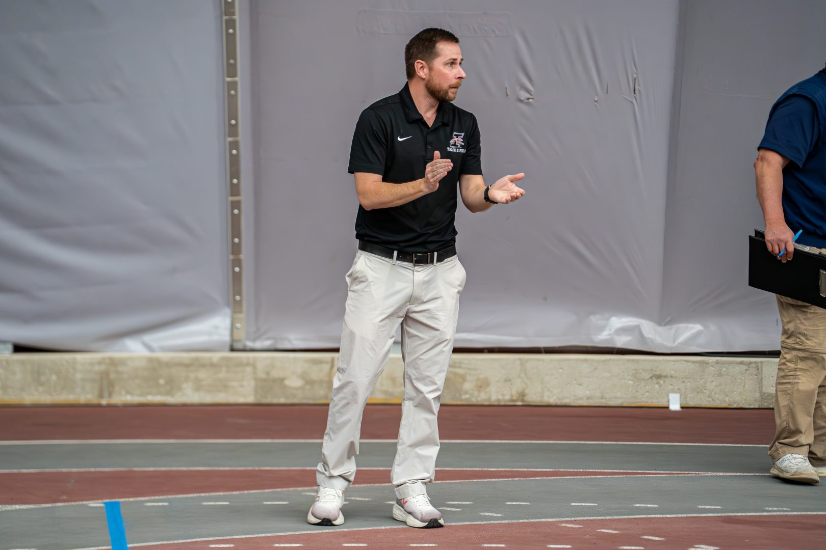 Director of Track and Field/Cross Country, Brad Robinson, cheering on his team in the 2026 GLVC indoor track and field championships.
