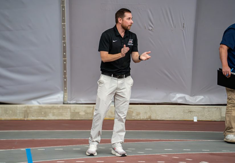 Director of Track and Field/Cross Country, Brad Robinson, cheering on his team in the 2026 GLVC indoor track and field championships.