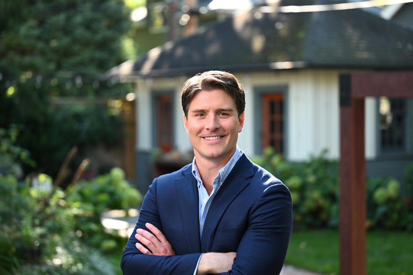 Beau Bayh Smiling near a house in a garden