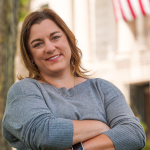 Jessica bailey smiling with her arms crossed