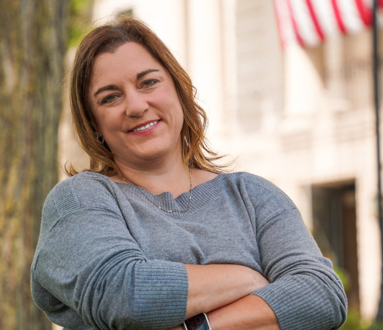 Jessica bailey smiling with her arms crossed